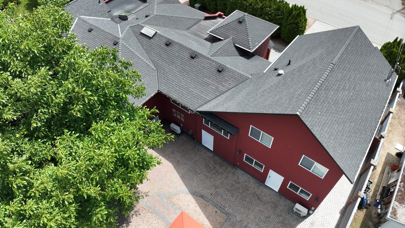 Sharp overhead of a rural home and its rooflines, the dated property record a drone flight captures.