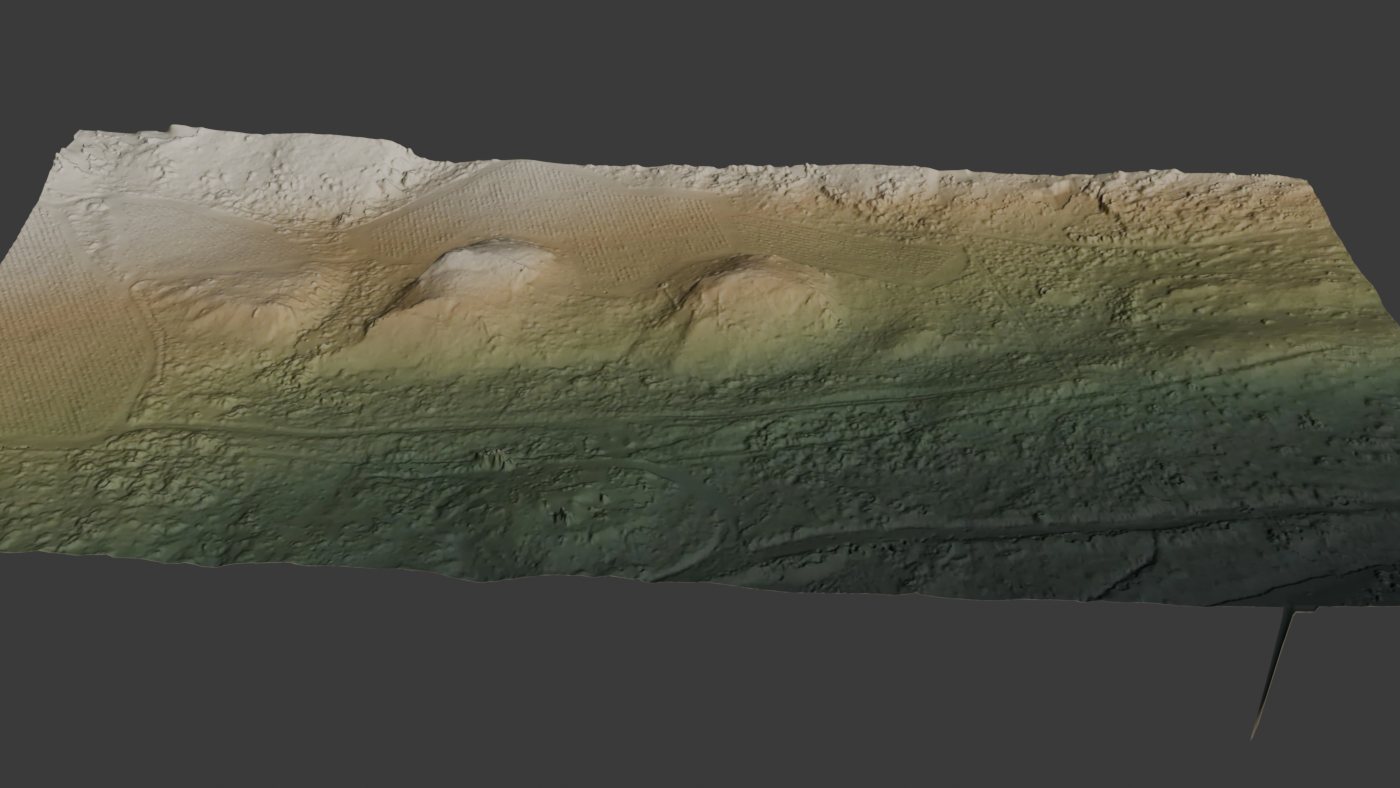 Rendered terrain surface with mounded ground forms, the kind of measurable surface model a stockpile and pit volumetric estimate is computed from. Demonstration data.