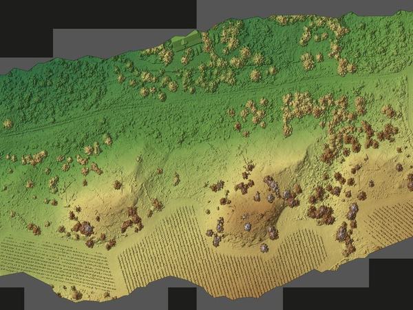 Rendered terrain surface of a worked site, the measurable ground model a photogrammetric volume estimate is computed from.